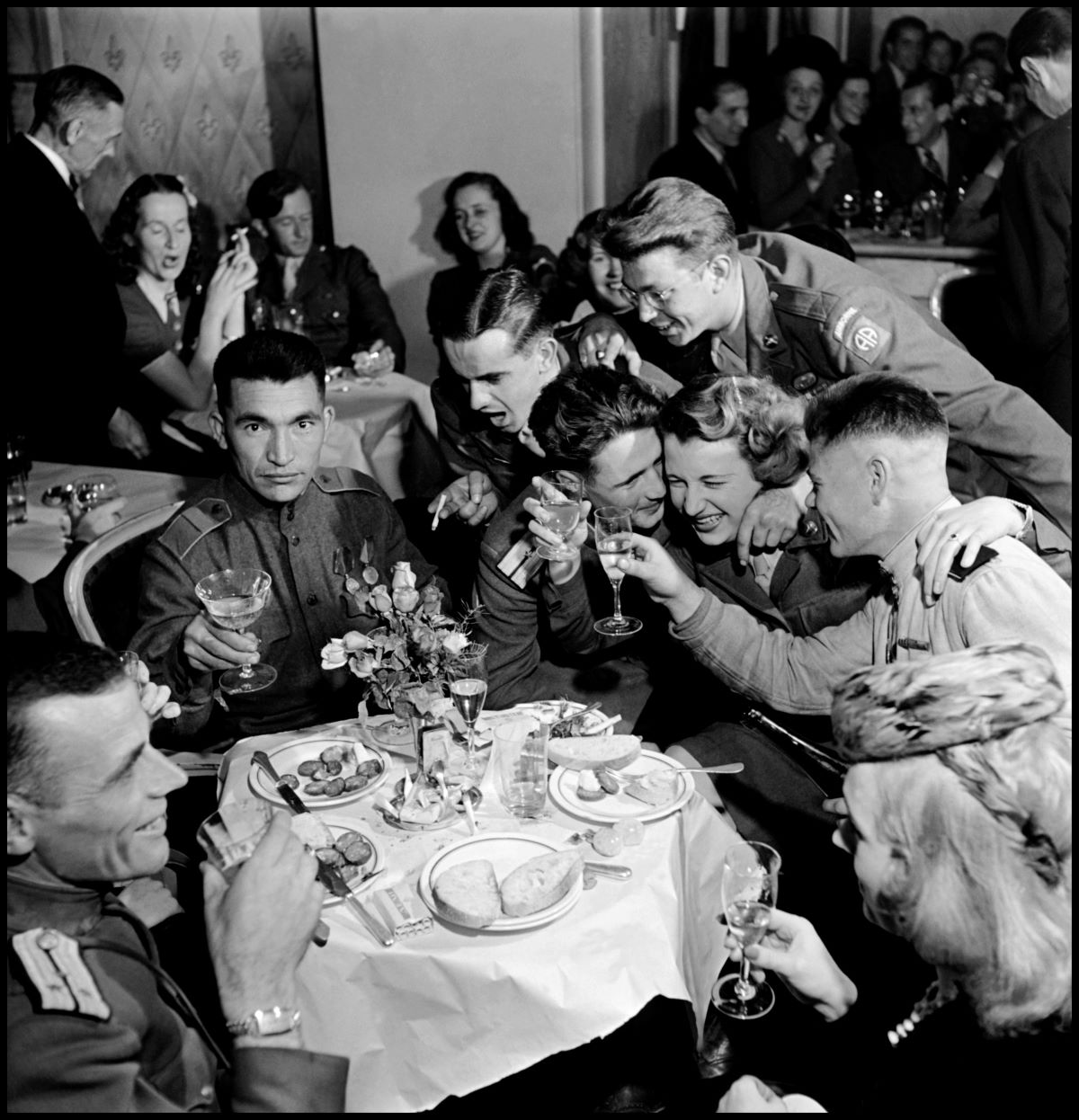 Russian and American soldiers, part of the Allied occupation forces, at a multi-national party, Berlin, Germany, 1945