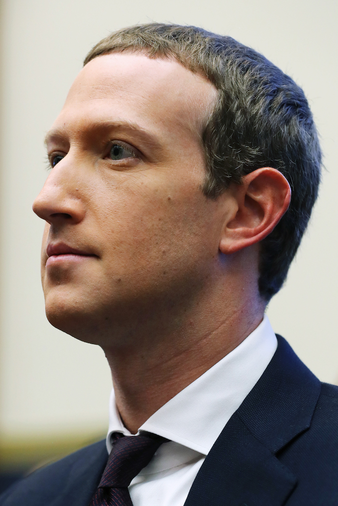 WASHINGTON, DC - OCTOBER 23: Facebook co-founder and CEO Mark Zuckerberg arrives to testify before the House Financial Services Committee in the Rayburn House Office Building on Capitol Hill October 23, 2019 in Washington, DC. Zuckerberg testified about Facebook's proposed cryptocurrency Libra, how his company will handle false and misleading information by political leaders during the 2020 campaign and how it handles its users’ data and privacy.